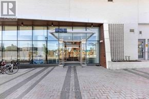 Toronto (Newtonbrook East) condo for rent - The front of a building with a glass entrance and a sign that reads "HOMELIFE MIRACLE REALTY LTD."