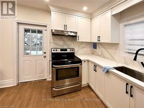 Niagara Falls (Dorchester) apartment for rent - A kitchen with a stove top oven and a microwave.