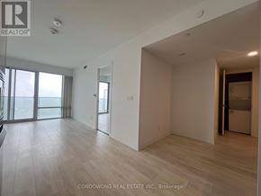 Toronto (Church-Yonge Corridor) condo for rent - A spacious room with a large window and a sliding glass door.