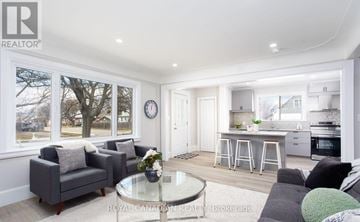 Hamilton (Hill Park) apartment for rent - A modern living room with a glass coffee table and grey couches.
