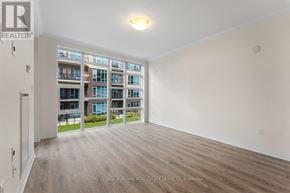 Grimsby (Grimsby Beach) condo for rent - A spacious room with a view of a building across the way.