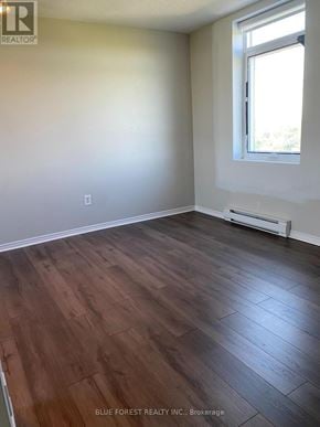 London South (South J) condo for rent - A room with wood flooring and a window.