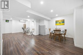 Pickering (Woodlands) apartment for rent - A room with wooden floors and a dining table set up with chairs.