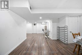 Pickering (Woodlands) apartment for rent - A room with wood flooring and white walls.