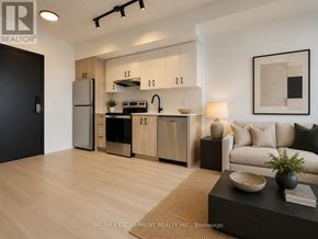 Burlington (Alton) condo for rent - A modern kitchen with wooden cabinets and stainless steel appliances.