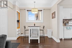 Hamilton (Stoney Creek) apartment for rent - A dining room with a white table and chairs.