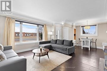 Hamilton (Stoney Creek) apartment for rent - A living room with a grey couch and a coffee table.