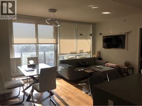Vancouver apartment for rent - A modern living room with a dining table and chairs.