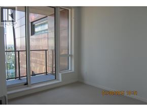 Vancouver apartment for rent - A room with a window and a wall with a date stamp.