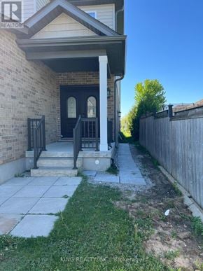 London North (North D) apartment for rent - A house with a front porch and a fence.