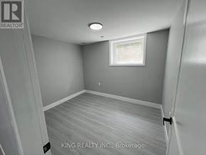 London North (North D) apartment for rent - A room with a window and a wooden floor.