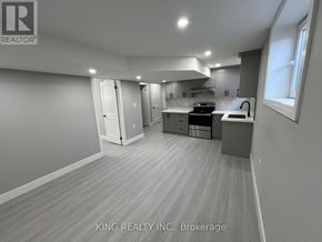 London North (North D) apartment for rent - A well-lit kitchen with a dining area in a house.