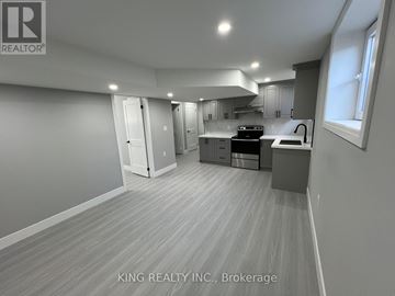 London North (North D) apartment for rent - A well-lit kitchen with a dining area in a house.