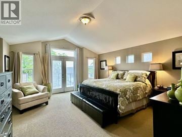Coquitlam apartment for rent - A bedroom with a large bed and a couch.