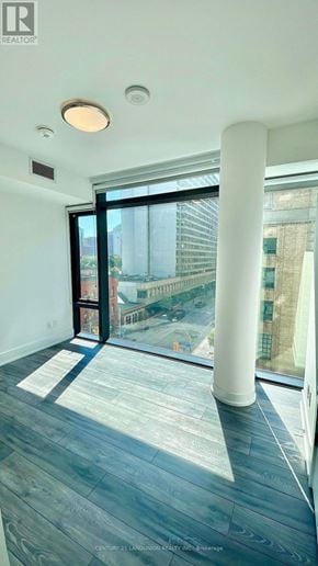 Toronto (Church-Yonge Corridor) condo for rent - A room with a large window and a view of a cityscape.