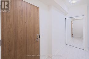 Vaughan (Vellore Village) condo for rent - A wooden door with a glass panel on the right side.