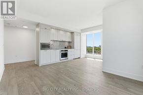 Toronto (Dovercourt-Wallace Emerson-Junction) condo for rent - A spacious kitchen with white cabinets and a large window.