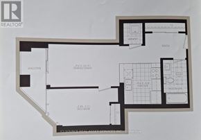 Hamilton (Beasley) condo for rent - A tall building with a mix of brick and white stone is surrounded by trees and has a clear blue sky above it.