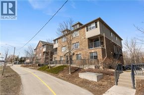 Kitchener condo for rent - A building with a REALTOR® sign in front of it.