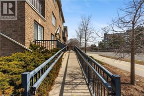 Kitchener condo for rent - A residential area with a Realty sign on a building.