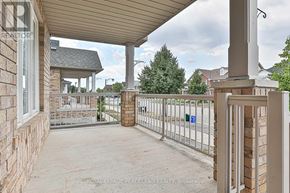 Markham (Wismer) apartment for rent - A patio area with a white railing and a wooden deck.
