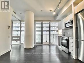 Toronto (Church-Yonge Corridor) condo for rent - A spacious kitchen with a refrigerator, oven, and microwave.