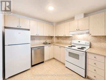 Mississauga (Meadowvale) condo for rent - A kitchen with a white fridge, dishwasher and stove.