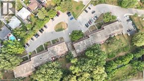 Kitchener townhouse for rent - A bird's eye view of a residential area with houses and cars.