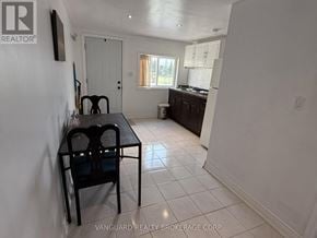 Bradford West Gwillimbury apartment for rent - A dining room with a table and chairs is shown.
