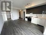 Toronto (Don Valley Village) condo for rent - A real estate listing image of a kitchen and living room.