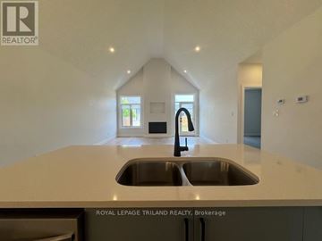Central Elgin house for rent - A modern kitchen with a sink and a window.