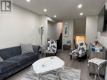 Brampton (Madoc) townhouse for rent - A living room with a grey couch and a white coffee table.