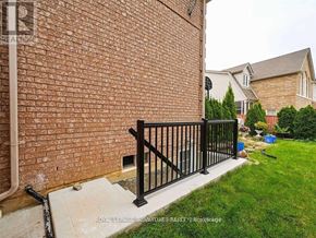 Mississauga (Central Erin Mills) apartment for rent - A black metal railing on a brick wall.