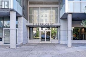 Waterloo condo for rent - The front of a building with the sign 318 Spruce St.