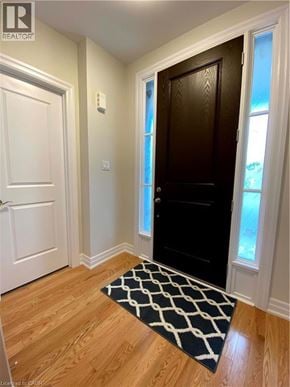 Niagara-On-The-Lake townhouse for rent - A hallway with a black door and a white door.
