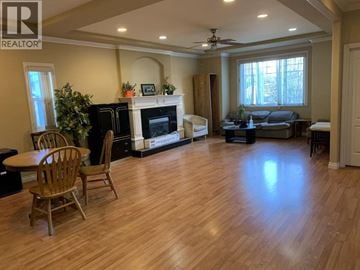 Richmond apartment for rent - A living room with a fireplace and a couch.