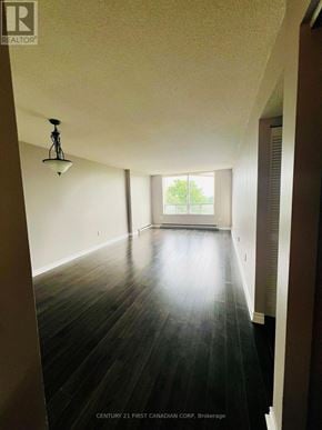 London North (North G) condo for rent - A long hallway with wood floors and a light on the ceiling.