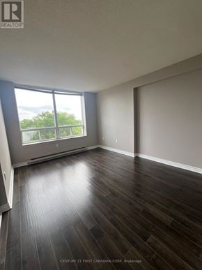 London North (North G) condo for rent - A room with wooden flooring and a large window.