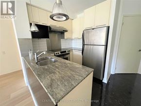Toronto (Church-Yonge Corridor) condo for rent - A kitchen with a granite countertop and stainless steel appliances.