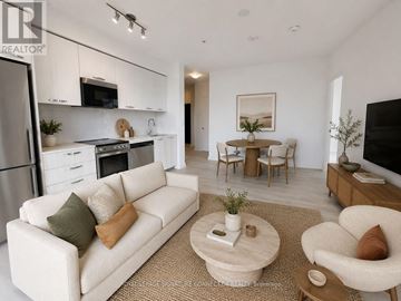 Hamilton (Corktown) condo for rent - A modern living room with a white couch and a coffee table.