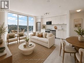 Hamilton (Corktown) condo for rent - A living room with a couch, chairs, and a coffee table.