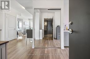 Oakville (Ro River Oaks) condo for rent - A brokerage office with a wooden floor and white walls.