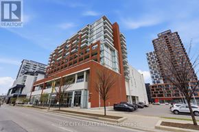 Markham (Unionville) condo for rent - A modern multi-story building with a glass facade is the main focus of the image.