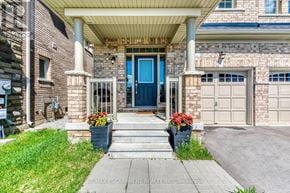 Hamilton (Waterdown) apartment for rent - A house with a blue door and a covered porch.