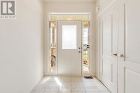 Hamilton (Waterdown) apartment for rent - A white door with a glass window is open.