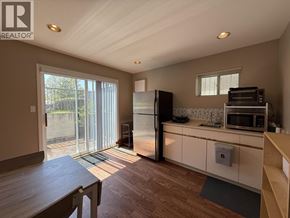 Vancouver apartment for rent - A kitchen with a refrigerator, microwave, and oven.