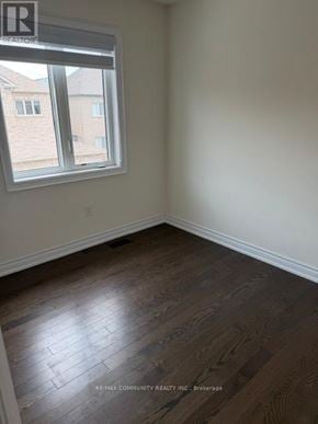 Markham (Cornell) apartment for rent - A room with a window and wooden flooring.