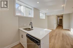 Kitchener duplex for rent - A modern kitchen with a sink and a window.