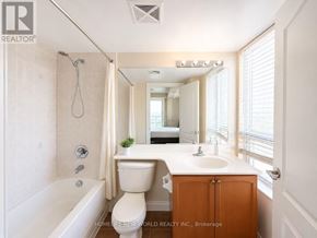 Toronto (Bendale) condo for rent - A white bathroom with a toilet, sink, and bathtub.