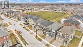 Vaughan (Kleinburg) apartment for rent - A bird's eye view of a residential neighborhood with houses and streets.
